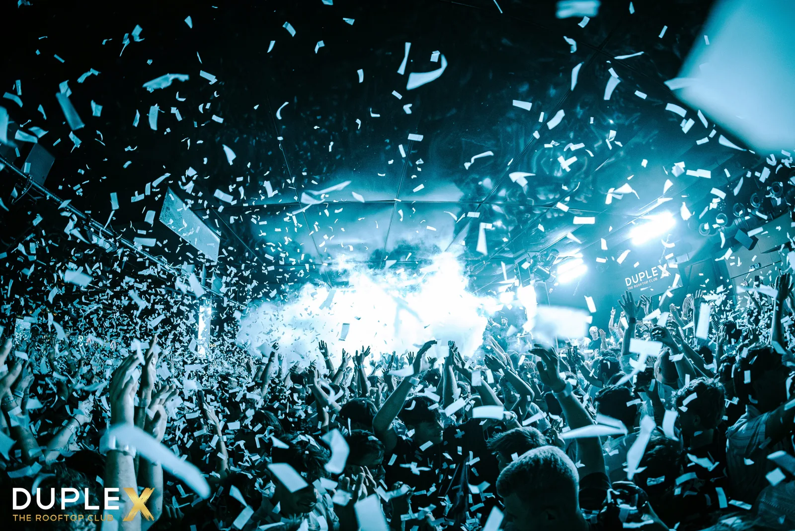 Dance floor at Duplex rooftop club with confetti falling over the crowd, Wenceslas Square, Prague
