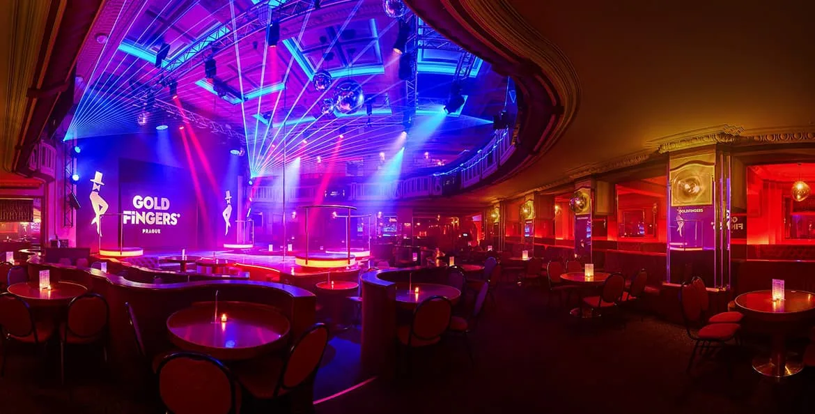 Stage with laser lights and candlelit tables inside Goldfingers, Hotel Ambassador, Wenceslas Square, Prague